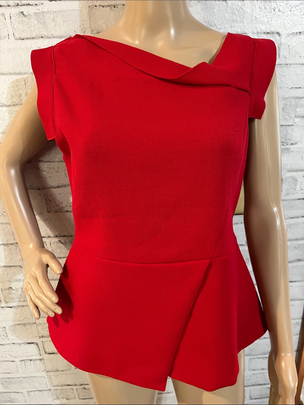 The Fold peplum sleeveless wool top